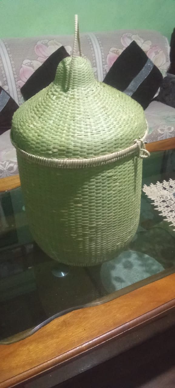 Lidded cane laundry basket with domed cover