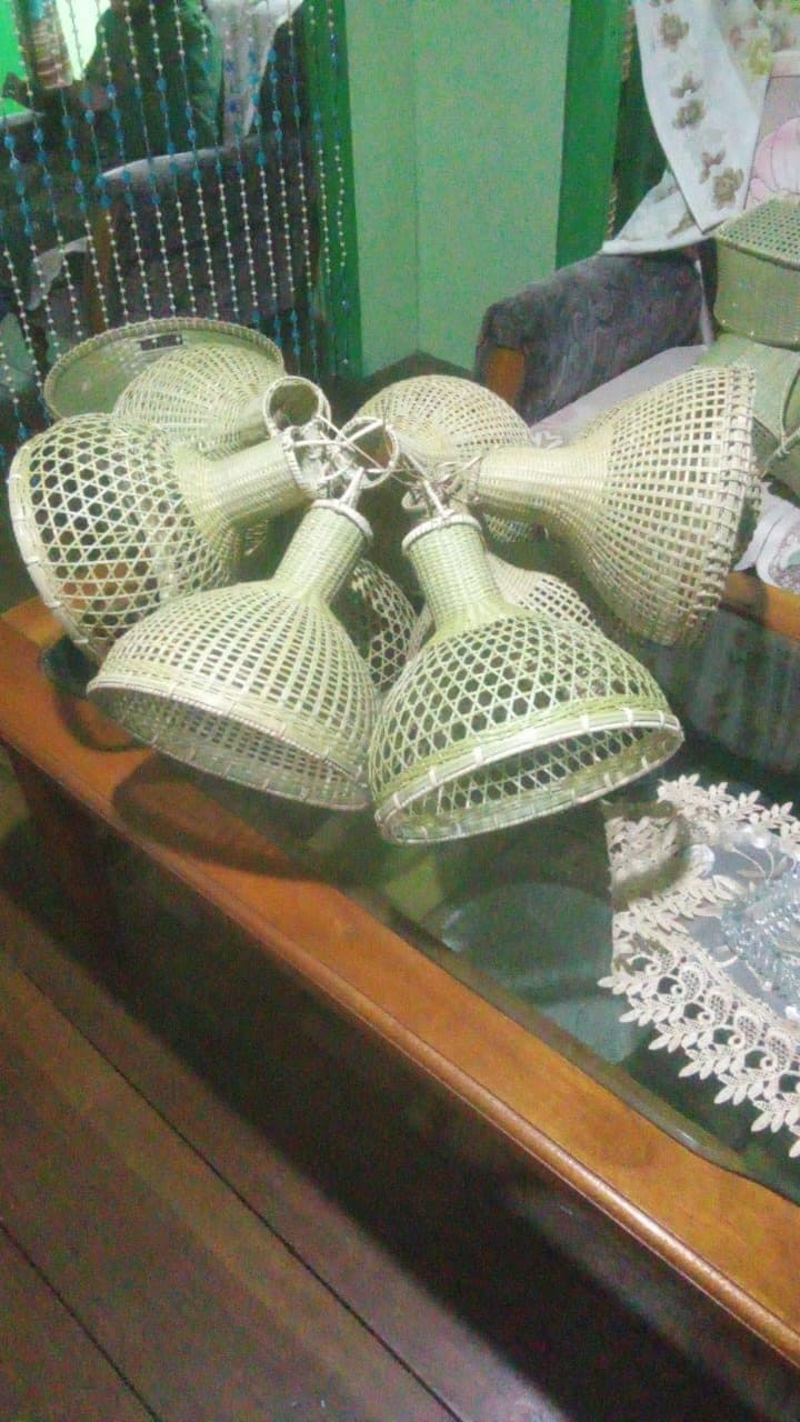 Batch of woven bamboo bell shades arranged after finishing
